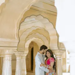 An intimate moment shared between the grand pillars of a Jaipur palace. I look for these quiet corners to capture the subtle, romantic interactions that truly define a couple's bond.