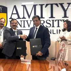 A handshake sealing the deal between Karate India Organisation and Amity University Online, a landmark opportunity for our players' education.