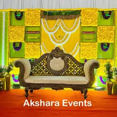 This Haldi-themed baby shower decor combines bright yellow marigolds with green fabric and intricate white floral patterns. The ornate sofa provides comfortable and regal seating for the main ceremony.