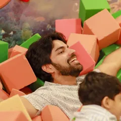 A father takes a joyful dive into our foam pit. We love it when parents get in on the fun and become kids again for a day.