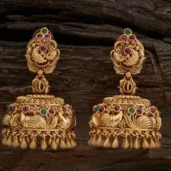 My collection is filled with classic jhumkas, and this pair is a customer favorite. These are traditional temple jhumkas with a detailed peacock stud, crafted in a rich antique gold tone and accented with ruby and emerald colored stones. They have a wonderful weight and swing, perfect for pairing with silk sarees.