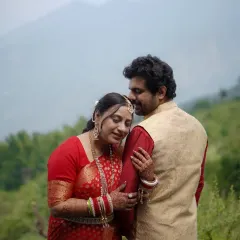 Finding solace in each other's arms. This candid couple portrait captures a moment of quiet intimacy amidst the beautiful natural scenery of a mountain destination.