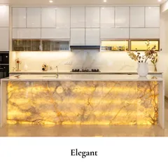 The kitchen is the heart of the home, and it deserves to be both a showpiece and a highly functional space. Here, a glowing onyx island becomes the centerpiece, combining the raw beauty of natural stone with luxurious, modern design.