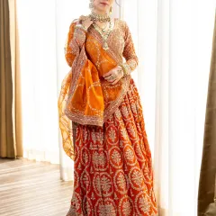 For the bride who wants to look nothing less than royal. This burnt orange lehenga with its rich embroidery and sequin work is a true masterpiece. We make sure every detail is perfect, so you can shine on your wedding day.