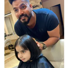 Our stylist giving a cute bob haircut to one of our youngest clients. We make sure the experience is fun and comfortable for everyone.