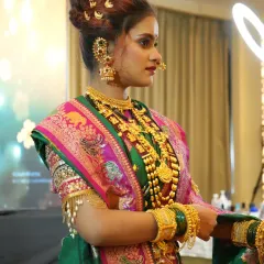 The complete profile of a Peshwai bride. We teach how to balance the heavy, authentic gold jewelry with makeup that enhances, but doesn't overpower, the bride's natural beauty.