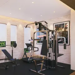 Another view of the home gym, showing the layout and the use of motivational posters to create an inspiring workout environment.