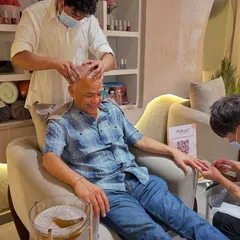 This is the full Bellissimo experience in one chair. A client enjoying a relaxing head massage while getting a meticulous manicure and a refreshing pedicure. We believe self care is a necessity, not a luxury.