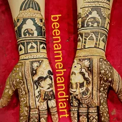 A unique bridal design celebrating sisterhood, with portraits of two sisters on the palms. The arms are decorated with royal palace and elephant motifs.