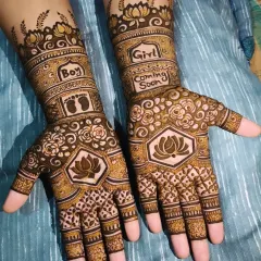 Mehndi is for every happy moment, including a godh bharai or baby shower. I created this special design with lotus flowers, baby feet, and a "Boy or Girl" theme to celebrate the new arrival.