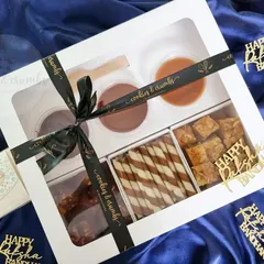 My Ultimate Dipping Box for Rakshabandhan. It includes brownie bites, wafer rolls, and tea cake bites with three delicious dips: Chocolate Ganache, Nutella, and Salted Caramel.