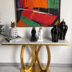 Here is a second look for the same console table, this time with a more symmetrical, monochrome theme. We've used our crowned lion showpieces and black ginger jars to create a balanced and sophisticated display.