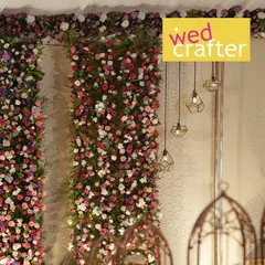 A detail shot of the indoor decor. This shows the vibrant floral panels next to modern geometric hanging lights, a beautiful blend of traditional and contemporary design elements.