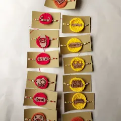 A collection of my crochet MDF rakhis, featuring fun tags like 'Bro', 'Bhai', and 'Swag Wala Bhai'. These are very popular for their quirky style.