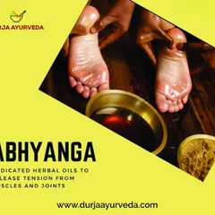 Abhyanga is a foundational Ayurvedic massage using medicated herbal oils. This image shows the application of oil to the feet, a key part of the therapy that helps release tension from muscles and joints.