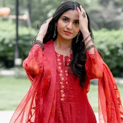 A confident and beautiful portrait from an engagement session. This image showcases the bride-to-be's style and the happy anticipation of the wedding to come.