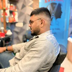 A side view of the high skin fade, showing the smooth transition from the skin to the longer hair on top. Precision is key for this style.