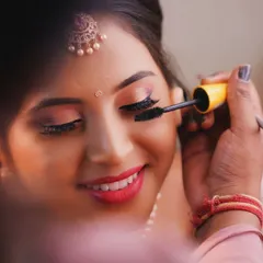 The final touch to make the eyes pop. Applying mascara is a crucial step to define the lashes and complete a glamorous eye makeup look.