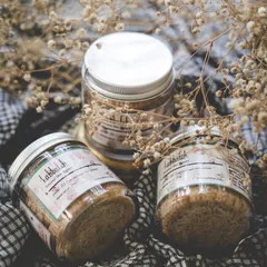 Jars of my 'Gulal' body polisher, ready for a self-care session. Using a natural exfoliator like this once or twice a week is a wonderful ritual for maintaining smooth, radiant skin.