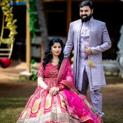 For a softer, contemporary traditional look, this couple chose a pink embroidered lehenga paired with a light purple sherwani. The complementary pastel tones work beautifully together for daytime photoshoots in garden settings.
