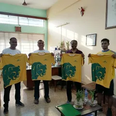 The full coaching team presenting our new official jersey. We believe in leading by example with a unified and professional appearance.