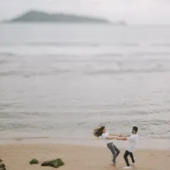 A playful, candid moment as Harman and Komal spin around on a quiet beach in Phuket. These are the fun, natural interactions I love to capture.