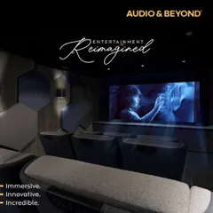 Entertainment, reimagined. This is our vision for an immersive, innovative, and incredible home cinema, featuring acoustically treated walls with hexagonal panels, comfortable tiered seating, and a perfectly calibrated screen for a truly cinematic feel.