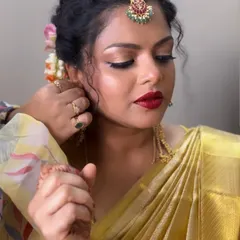 A behind-the-scenes moment, placing the earring on my client. Ensuring every detail is perfect is part of the service and a key lesson for my students.