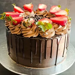 You can never go wrong with a classic. My Death by Chocolate cake is pure indulgence, with a rich, moist chocolate sponge, silky ganache, a dramatic drip effect, and topped with fresh strawberries.