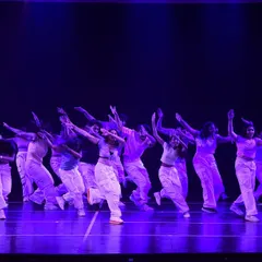 A full-cast performance showing a large group moving in perfect sync. This demonstrates our ability to choreograph for large ensembles, ensuring everyone hits their mark with power and precision.