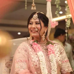 That priceless, candid smile of a happy bride on her wedding day. This look was all about dewy skin and mesmerizing eyes to create a perfect bridal combination.