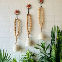 For those who love a rustic, bohemian vibe, our Classic White Boho Beaded Ceramic Bells are a perfect fit. We string them with natural wooden beads and jute twine for a simple, earthy feel.