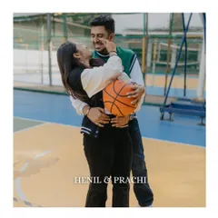 A sweet and playful moment where the couple shares a laugh while holding a basketball. This candid interaction is what makes personalized photoshoots so special.