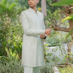 The same light pista Indo-Western set, shown from a different angle. The clean silhouette and soft color make it ideal for an engagement or garden party.