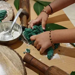 Kneading, rolling, and pressing playdough is powerful practice for small hands. Using natural materials like leaves and wooden rolling pins, children build fine motor strength and finger dexterity, all while calming the mind and sparking creativity.