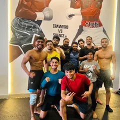 All smiles after a grueling session. The camaraderie here is real. We push each other to our limits and then celebrate the progress we've made together.