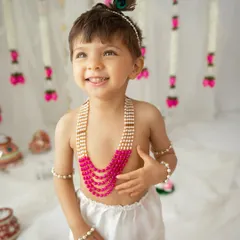 The pure, unfiltered joy of childhood. This little one's infectious smile during his Little Krishna themed session is a perfect example of how I create a fun, comfortable space for your child's personality to shine.
