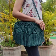 See how our classy dark green macrame sling bag completes an outfit. It's spacious enough for your essentials and adds a touch of handmade elegance to any look, from casual daywear to an evening out.