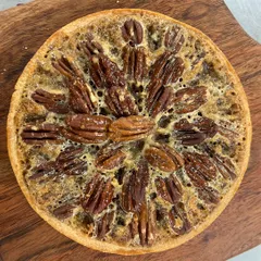 November calls for cozy moments and pecan tarts. This tart, with its sweet, crunchy pecans and buttery crust, truly tastes like comfort.