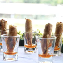 My crispy spring rolls are a perfect bite-sized appetizer. I serve them in shot glasses with a bit of sweet chili oil at the bottom for an extra kick of flavor.