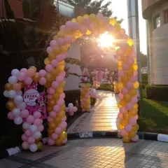 A welcoming entrance for a Minnie Mouse themed party. Guests are greeted by a beautiful balloon arch in pink, gold, and white, setting the tone for the celebration from the moment they arrive.