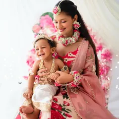A joyous moment between a sister and her baby brother, both dressed beautifully for this Janmashtami themed shoot. The love and happiness here are just wonderful.