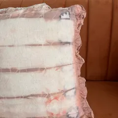 A closer look at the details on this naturally dyed cushion cover. The subtle variations in color and the ruffled edges are what make handmade items so special.