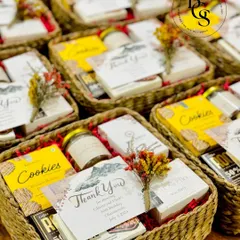 These rustic thank you baskets are a charming way to show your gratitude. Filled with cookies and other treats, and adorned with a custom thank you card and dried flowers, they are perfect as return favours for a wedding or special event.