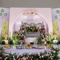 The full stage setup for Inara's naming ceremony, featuring a magnificent silver cradle adorned with pastel hydrangeas. The backdrop was custom-printed with a delicate floral design to match the soft, dreamy theme.