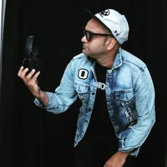 A different look, featuring a denim jacket and a confident pose with my headphones. I believe a DJ's style should be as dynamic as their music.