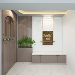 Elegant first impressions start at the doorstep. This design for the Pandita family features a custom safety door with arched detailing, a floating nameplate, and a bench with built-in shoe storage.