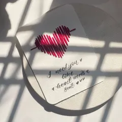 "I need you like a heart needs a beat." A little bit of romance captured in a handmade card, with the sunlight creating beautiful shadows.
