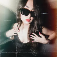 A close-up shot from the vintage car series, focusing on the bold red lip and sunglasses.