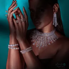 For the Jeweleravi campaign, I used dramatic lighting to create this high-glamour shot, making the diamond necklace and bracelets the undeniable hero.
